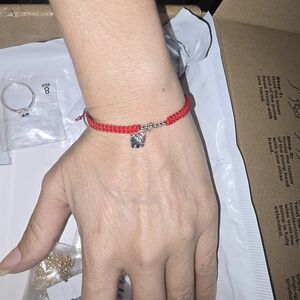 Red Braided Bracelet with Silver Charm